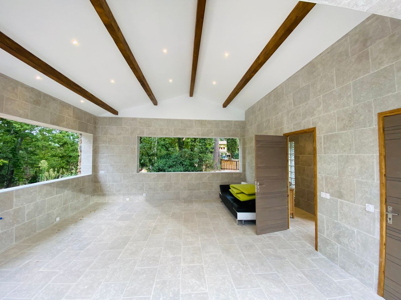 A bright room under exposed timber beams